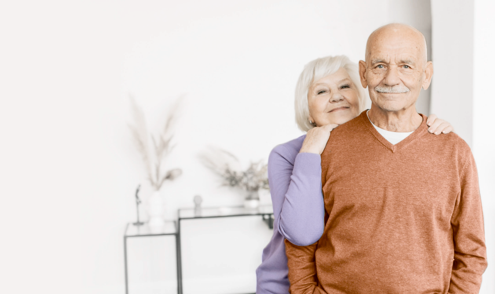 Happy elderly couple receiving compassionate home care services in Omaha, Nebraska