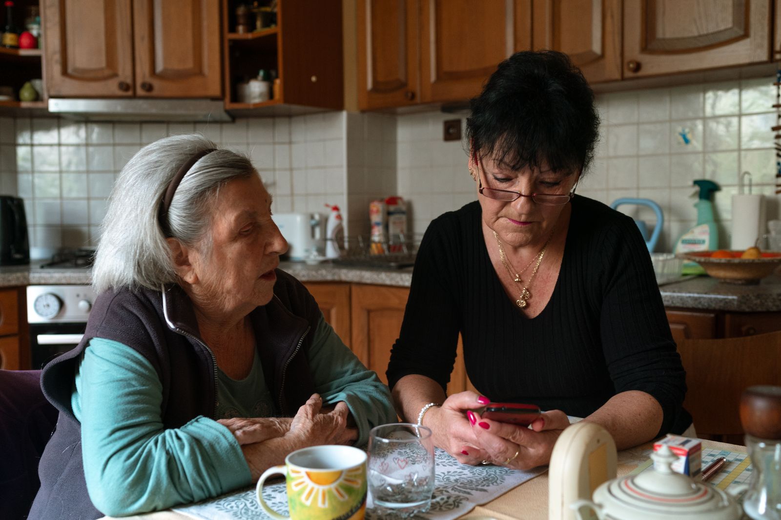 Caregiver and older adult discussing support options at home